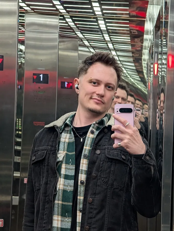 Chris Parsons taking a selfie in a mirrored lift